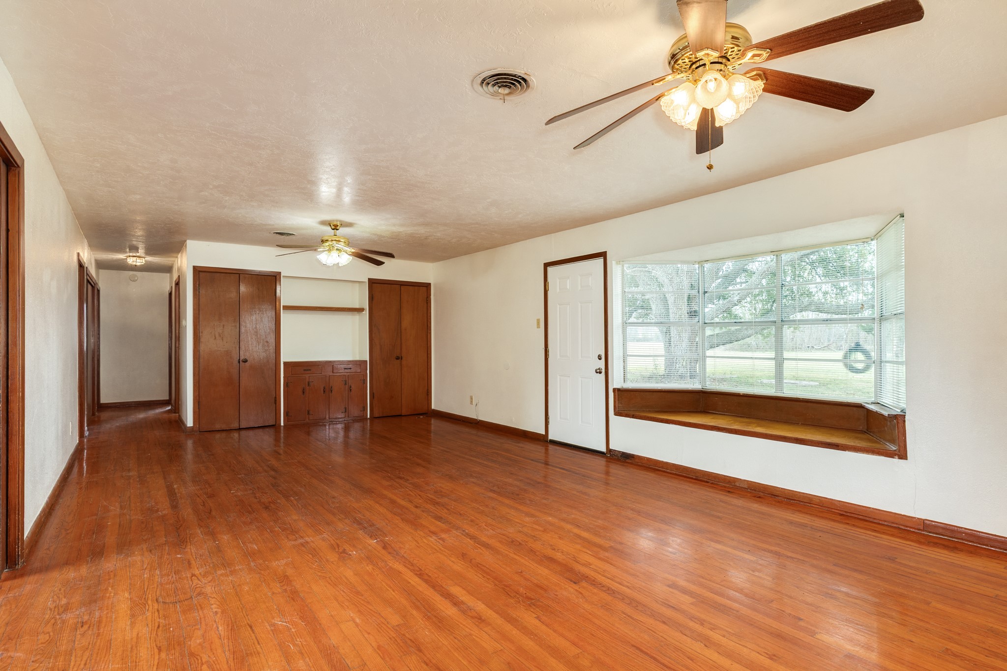3702 Cedar Rapids Parkway Iowa Colony, TX 77583 - Photo 6 of 31 a view of empty room with wooden floor and fan