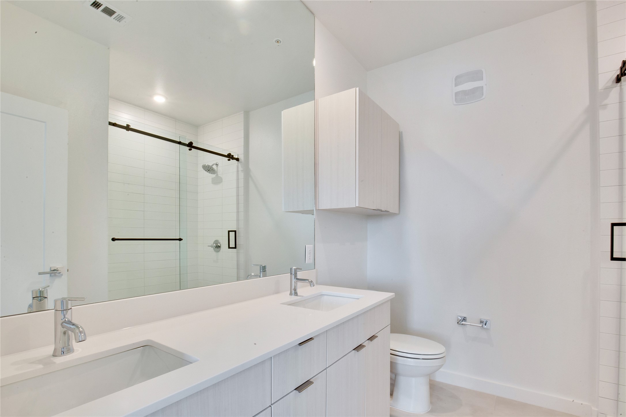 4802 South Congress Avenue, Unit 407 Austin, TX 78745 - Photo 11 of 25 a bathroom with a sink toilet and shower