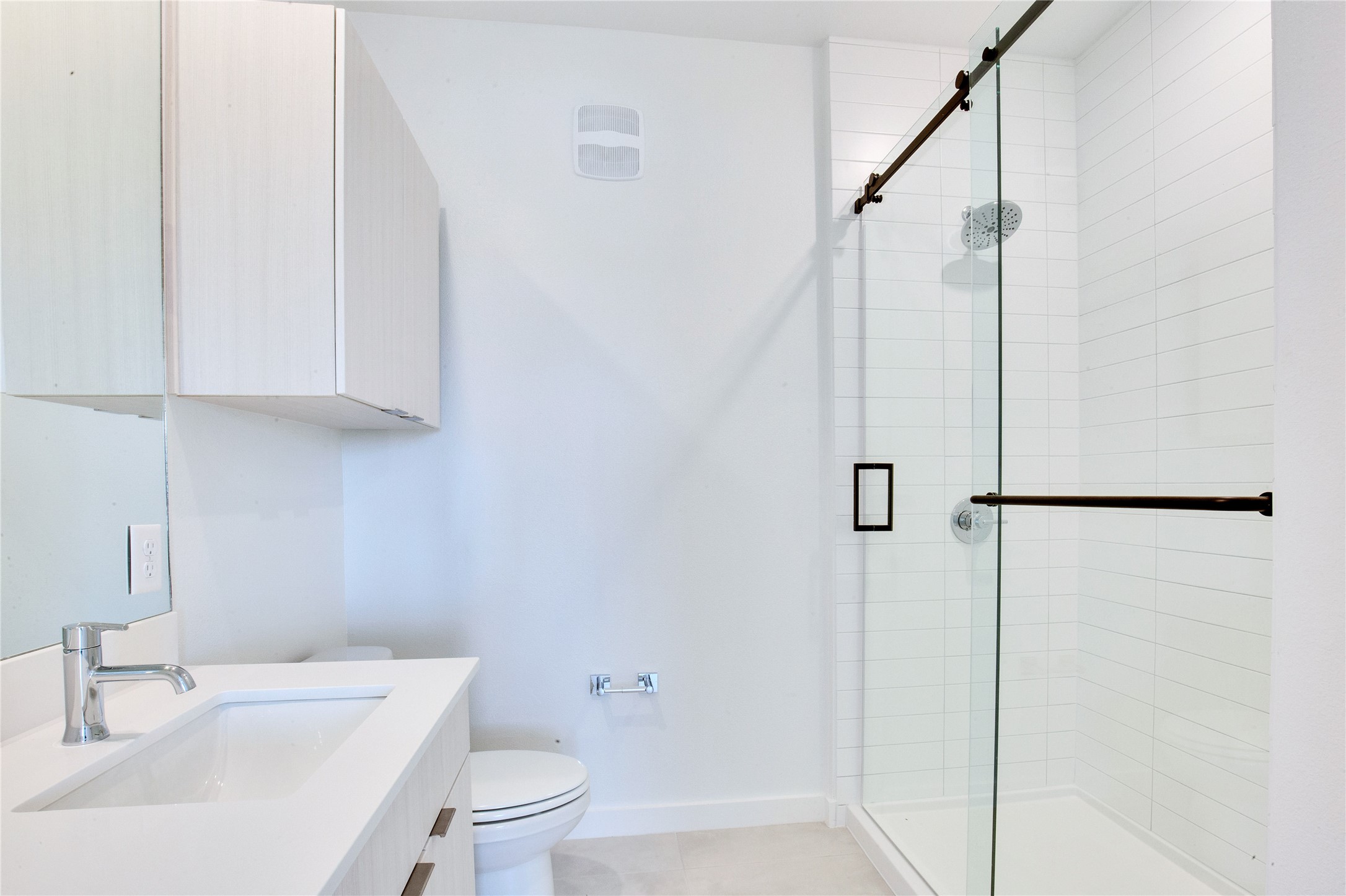 4802 South Congress Avenue, Unit 407 Austin, TX 78745 - Photo 12 of 25 a bathroom with a sink toilet and shower