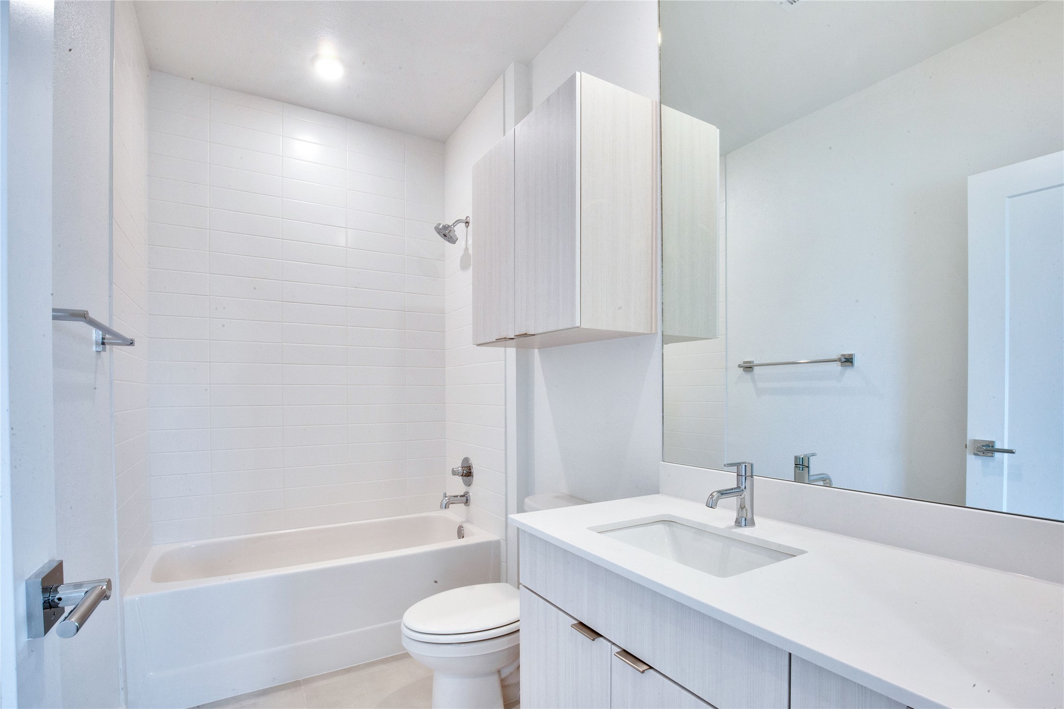 4802 South Congress Avenue, Unit 407 Austin, TX 78745 - Photo 15 of 25 a bathroom with a sink toilet and shower