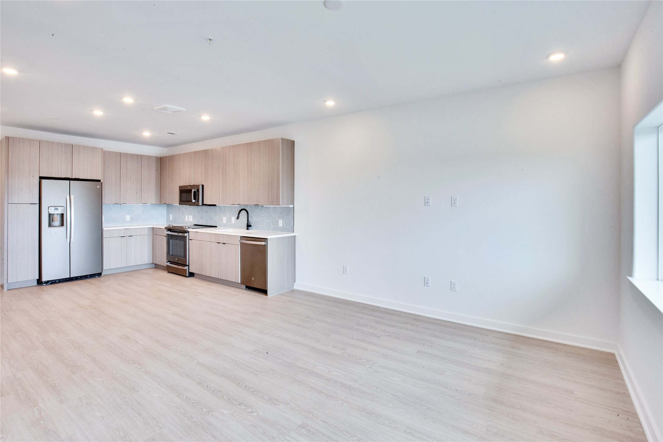 4802 South Congress Avenue, Unit 407 Austin, TX 78745 - Photo 6 of 25 a view of kitchen with wooden floor