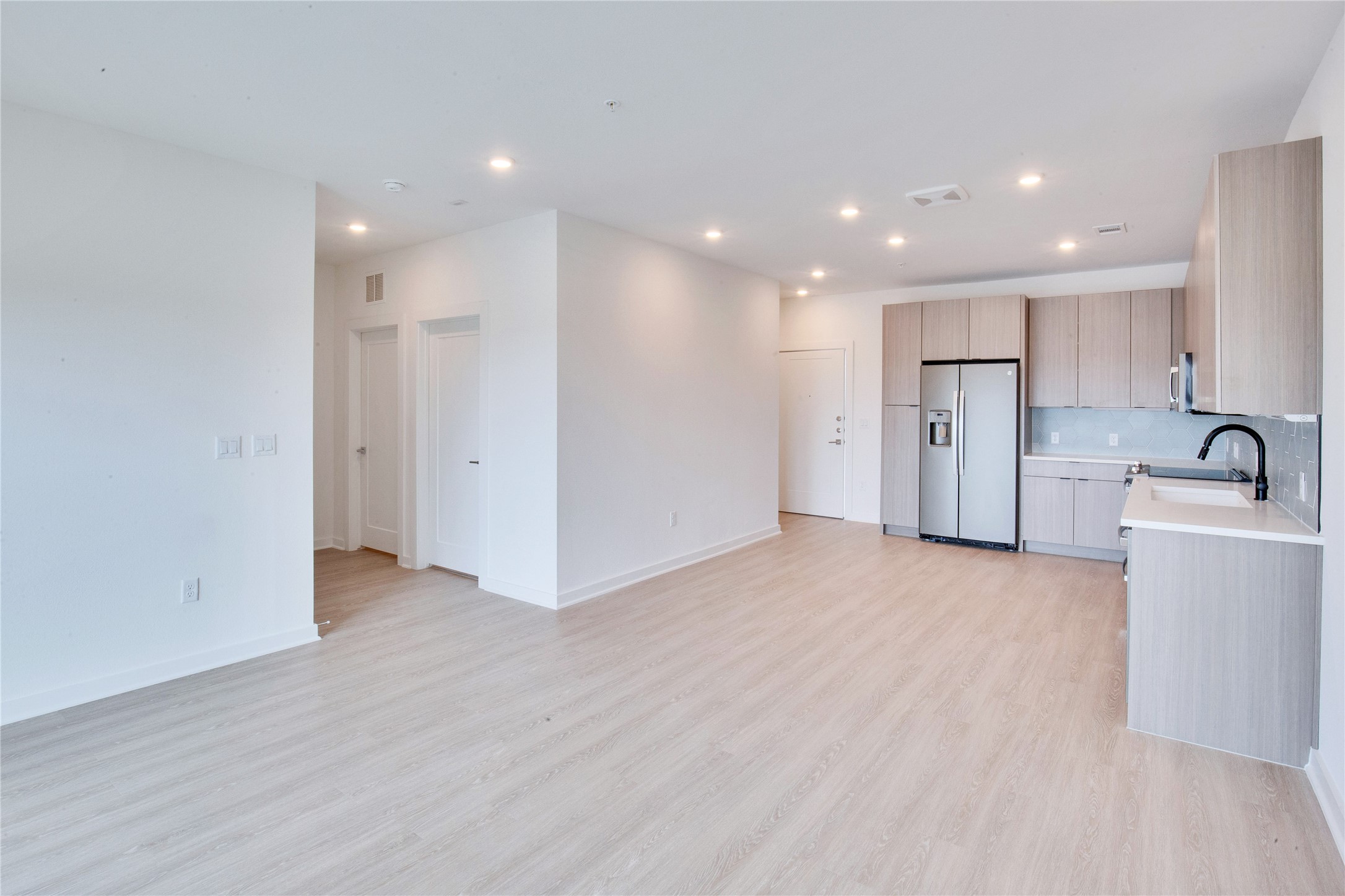 4802 South Congress Avenue, Unit 407 Austin, TX 78745 - Photo 7 of 25 a view of a kitchen with a sink and a refrigerator