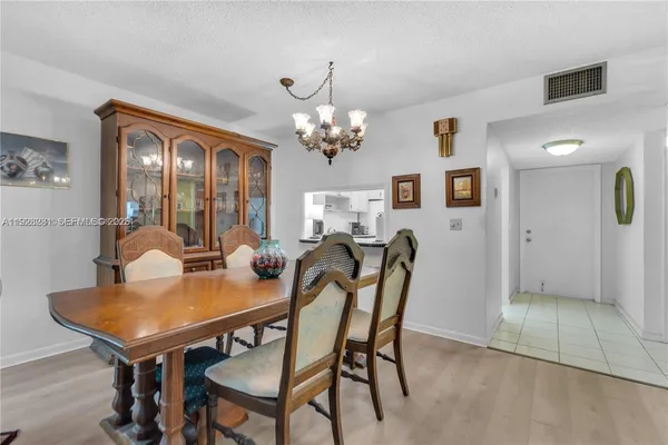 a view of a dining room with furniture and window