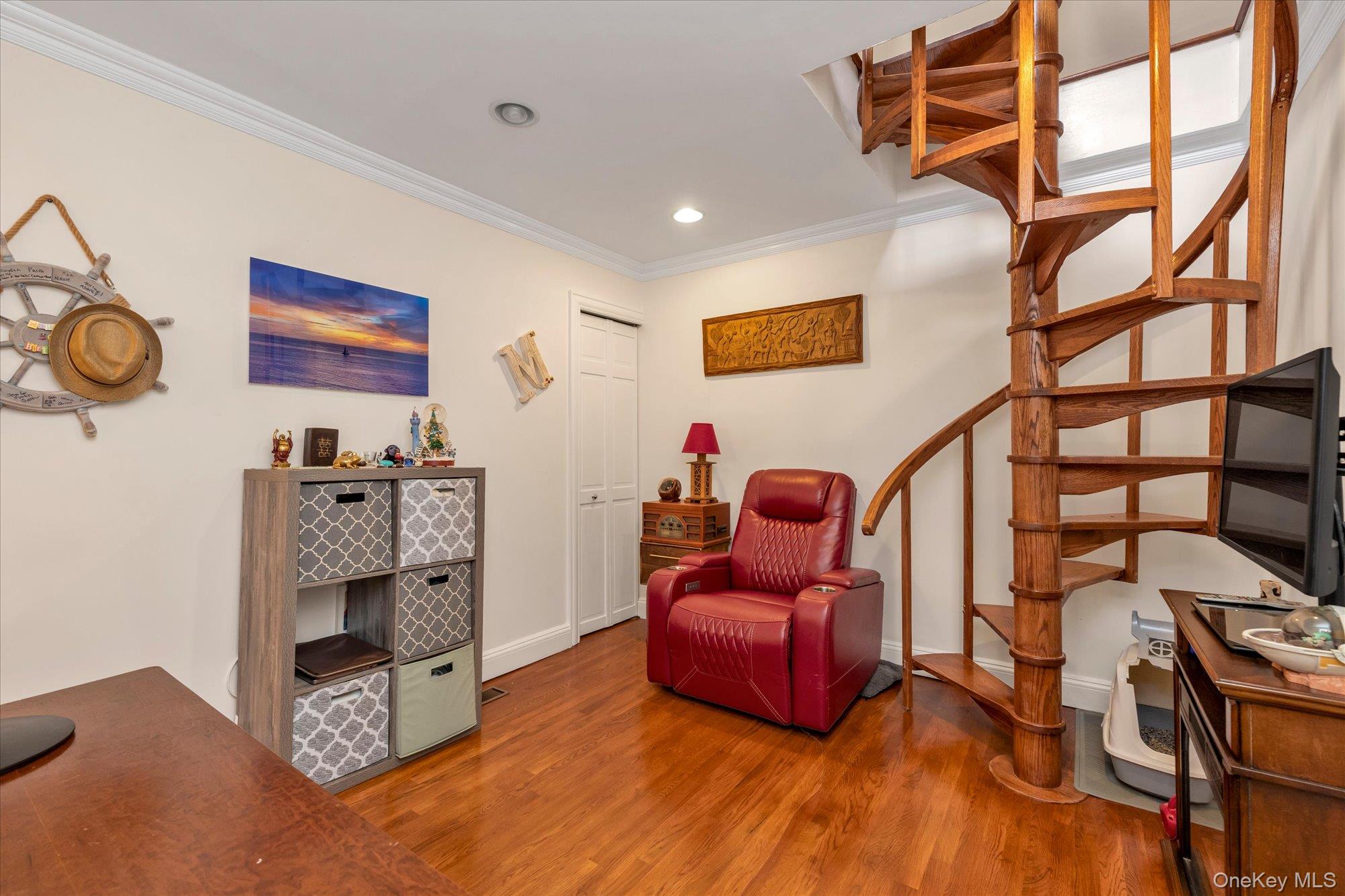 150 I U Willets Road Albertson, NY 11507 - Photo 17 of 21 2nd bedroom with wood spiral staircase with open risers and wood-finish flooring
