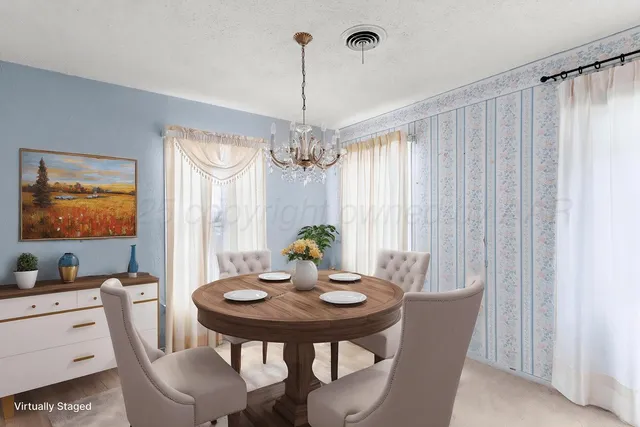 a view of a dining room with furniture window and outside view