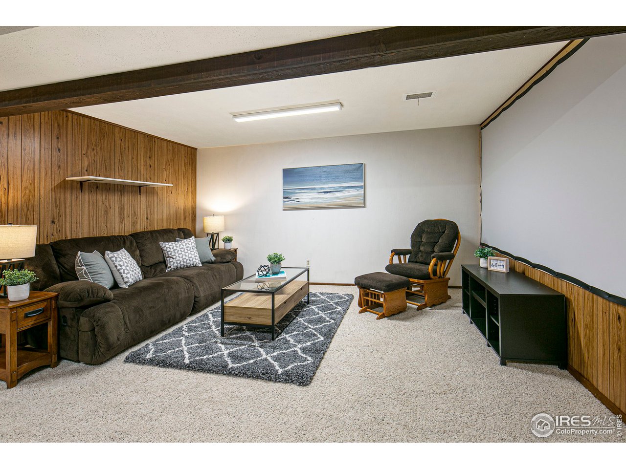 3415 West 5th St Road Greeley, CO 80634 - Photo 17 of 27 a living room with furniture and a flat screen tv