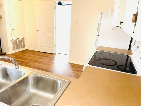 a view of a kitchen sink and a tub