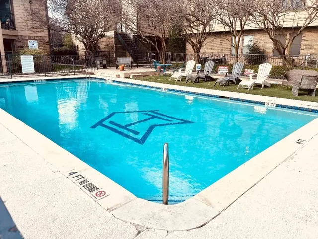 a view of swimming pool with a patio
