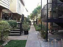 5608 Cougar Drive, Unit 203 Austin, TX 78745 - Photo 9 of 9 a view of a pathway with a house