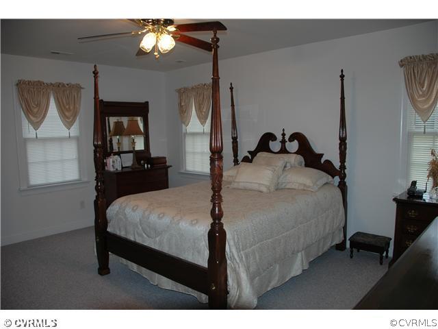 17363 Parsons Ridge Road Beaverdam, VA 23015 - Photo 6 of 12 a bedroom with a bed window and wall painting
