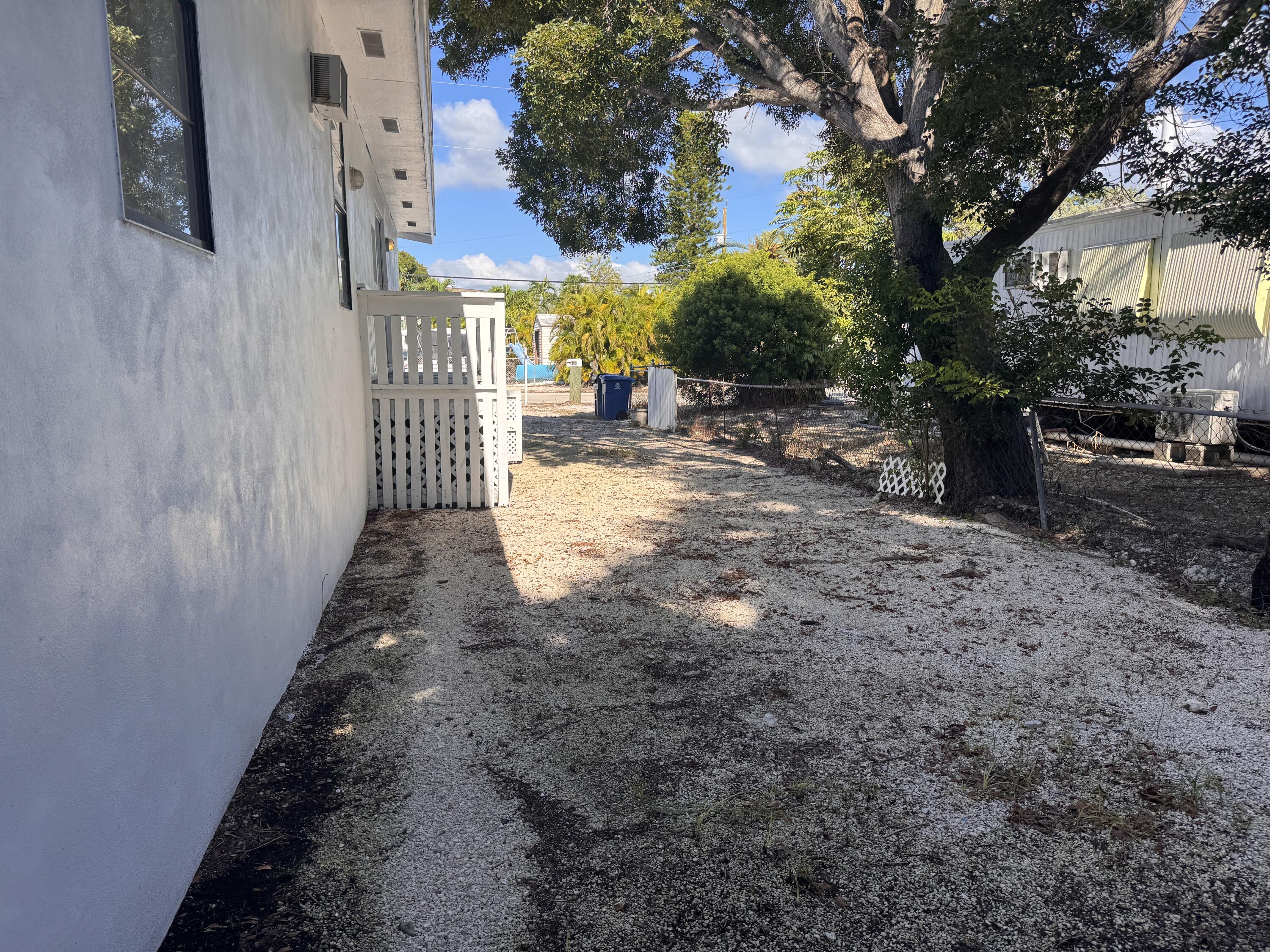 969 Plantation Road Key Largo, FL 33037 - Photo 24 of 26 a view of a yard with plants and trees
