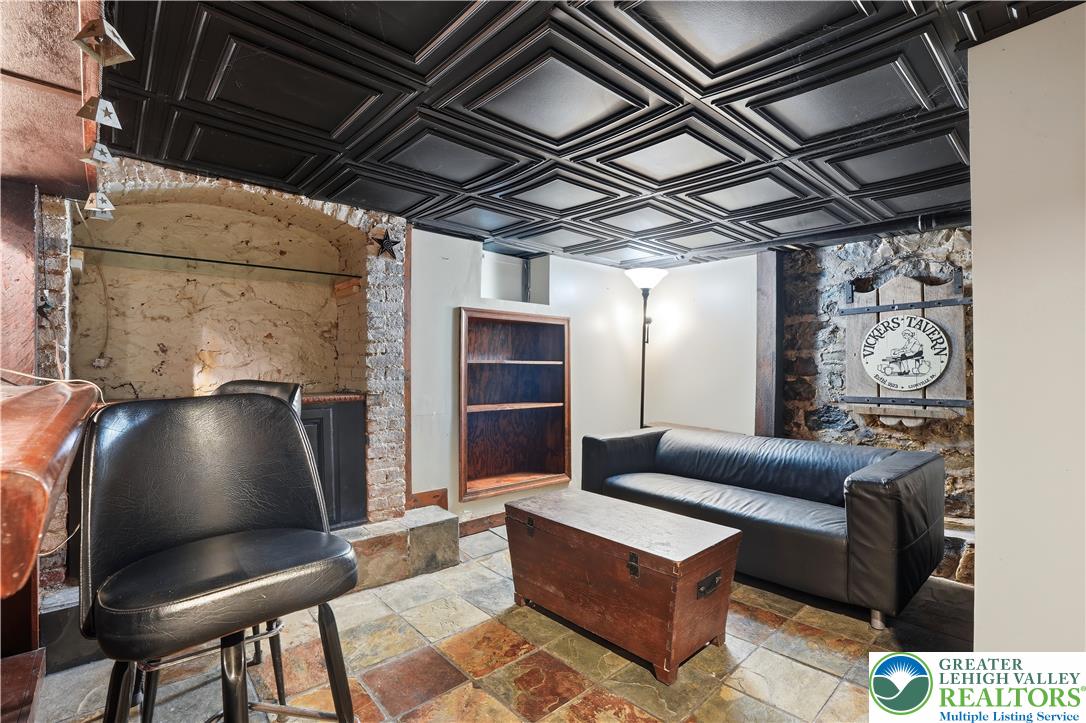 2014 Linden Street Bethlehem, PA 18017 - Photo 50 of 85 A relaxed gathering space showcasing a richly textured ceiling and a stone wall.