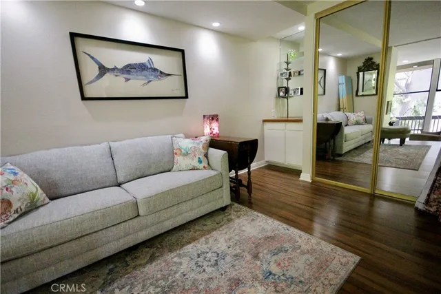 a living room with furniture and a rug