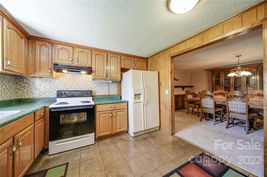 2081 Conservancy Road Kershaw, SC 29067 - Photo 23 of 46 a kitchen with refrigerator and cabinets
