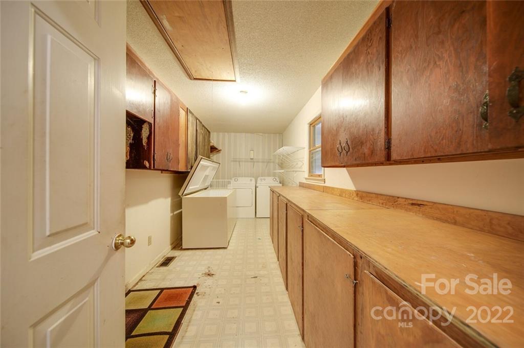2081 Conservancy Road Kershaw, SC 29067 - Photo 25 of 46 a view of a kitchen with a sink and cabinets