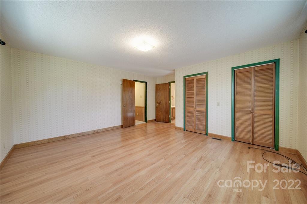 2081 Conservancy Road Kershaw, SC 29067 - Photo 27 of 46 an empty room with wooden floor and closet