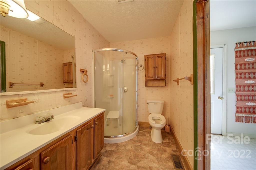 2081 Conservancy Road Kershaw, SC 29067 - Photo 30 of 46 a bathroom with a sink a toilet and shower