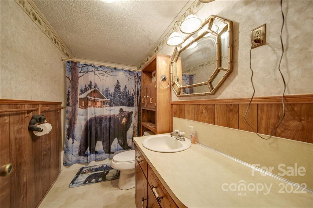 2081 Conservancy Road Kershaw, SC 29067 - Photo 39 of 46 a bathroom with a sink a mirror and shower