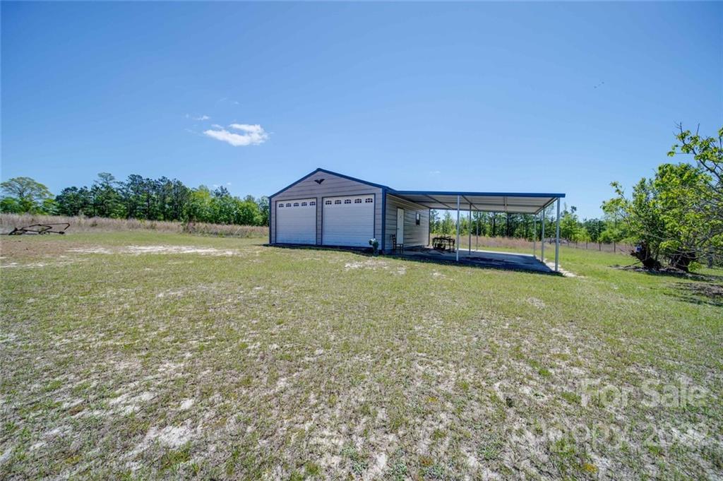 2081 Conservancy Road Kershaw, SC 29067 - Photo 41 of 46 a view of a house with a yard