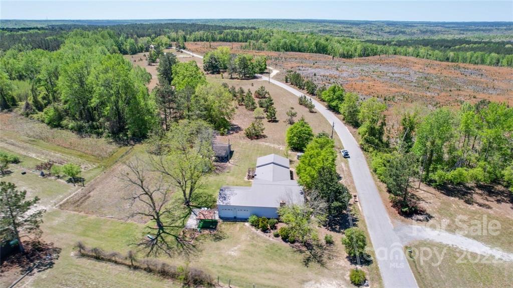 2081 Conservancy Road Kershaw, SC 29067 - Photo 45 of 46 an aerial view of a house with a yard and lake view