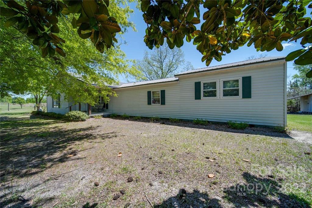 2081 Conservancy Road Kershaw, SC 29067 - Photo 10 of 46 a backyard of a house with lots of green space