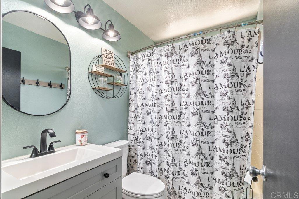 32467 Cervin Circle Temecula, CA 92592 - Photo 19 of 36 a bathroom with a sink toilet and shower