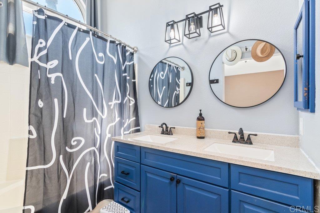 32467 Cervin Circle Temecula, CA 92592 - Photo 20 of 36 a bathroom with a sink and a mirror