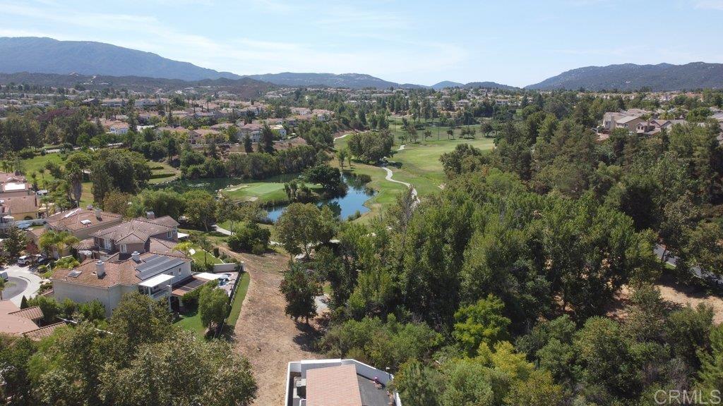 32467 Cervin Circle Temecula, CA 92592 - Photo 29 of 36 an aerial view of green landscape with trees houses and mountain view