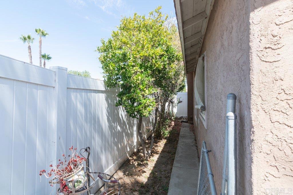 32467 Cervin Circle Temecula, CA 92592 - Photo 33 of 36 a view of a pathway of a house with potted plants