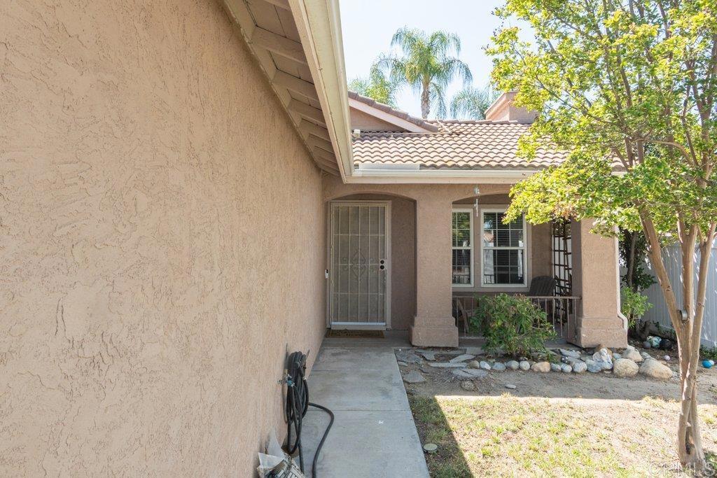 32467 Cervin Circle Temecula, CA 92592 - Photo 6 of 36 a front view of a house with garden