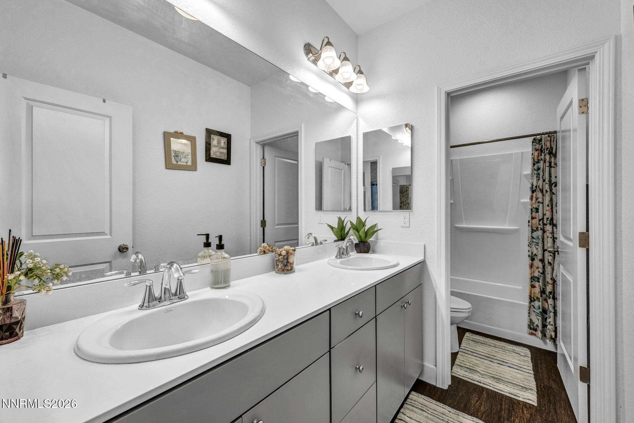 969 Estuary Circle Reno, NV 89506 - Photo 28 of 38 a bathroom with a sink double vanity and a mirror