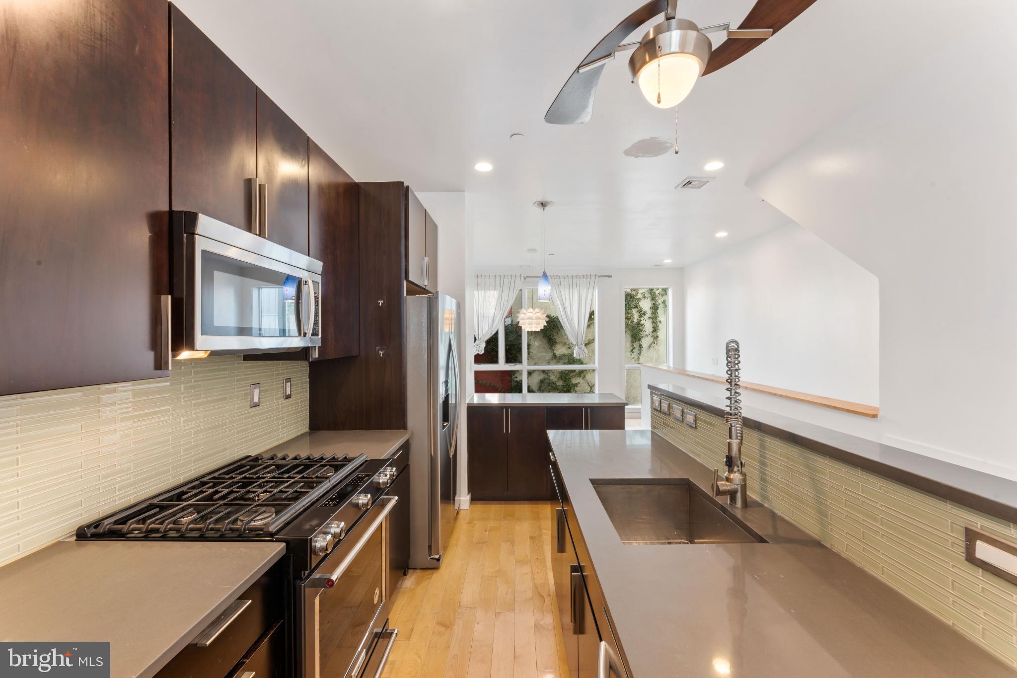 333 Green Street, Unit 7 Philadelphia, PA 19123 - Photo 16 of 40 Sleek modern kitchen with natural light.