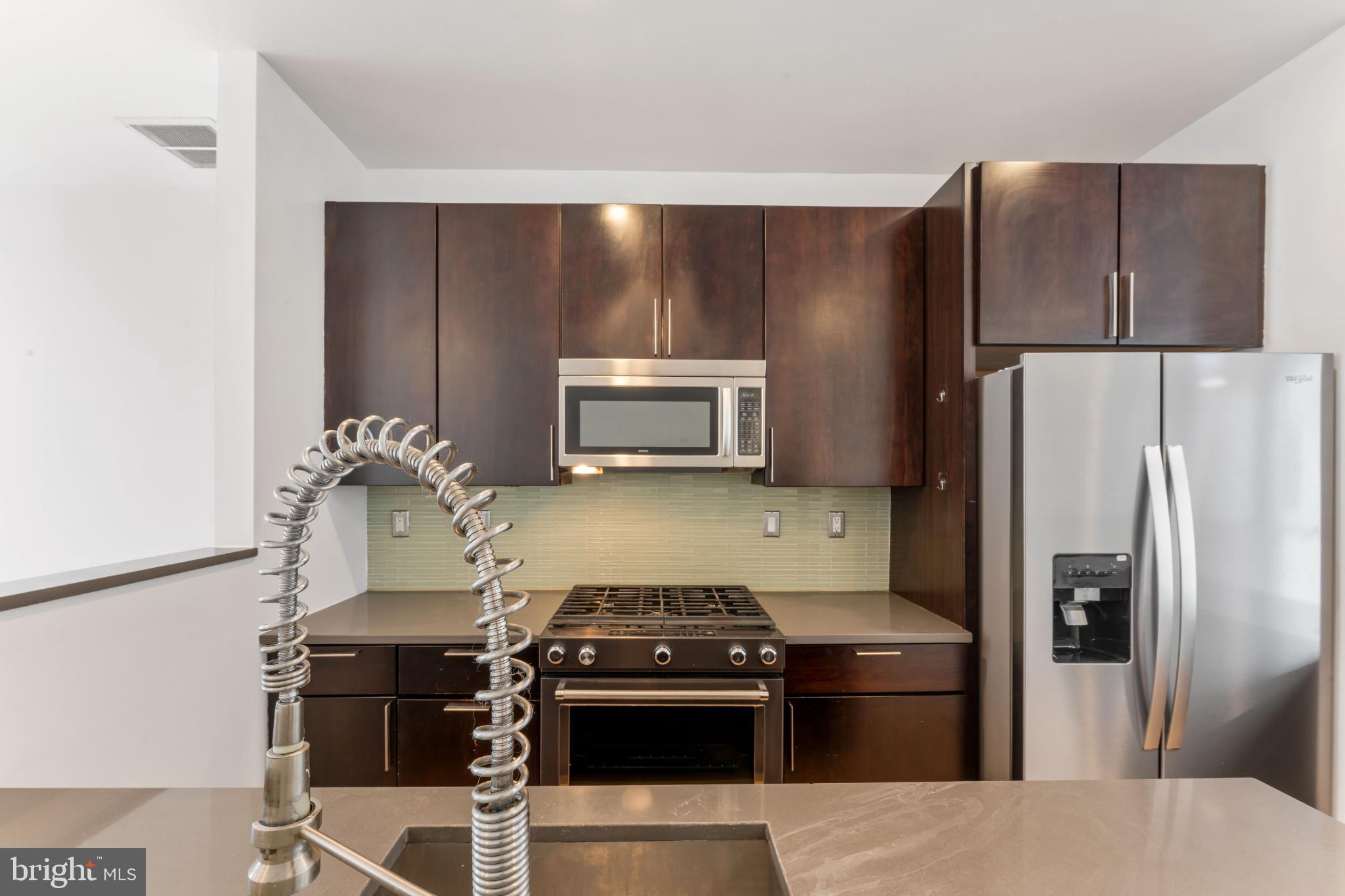 333 Green Street, Unit 7 Philadelphia, PA 19123 - Photo 17 of 40 Sleek modern kitchen with stylish finishes.