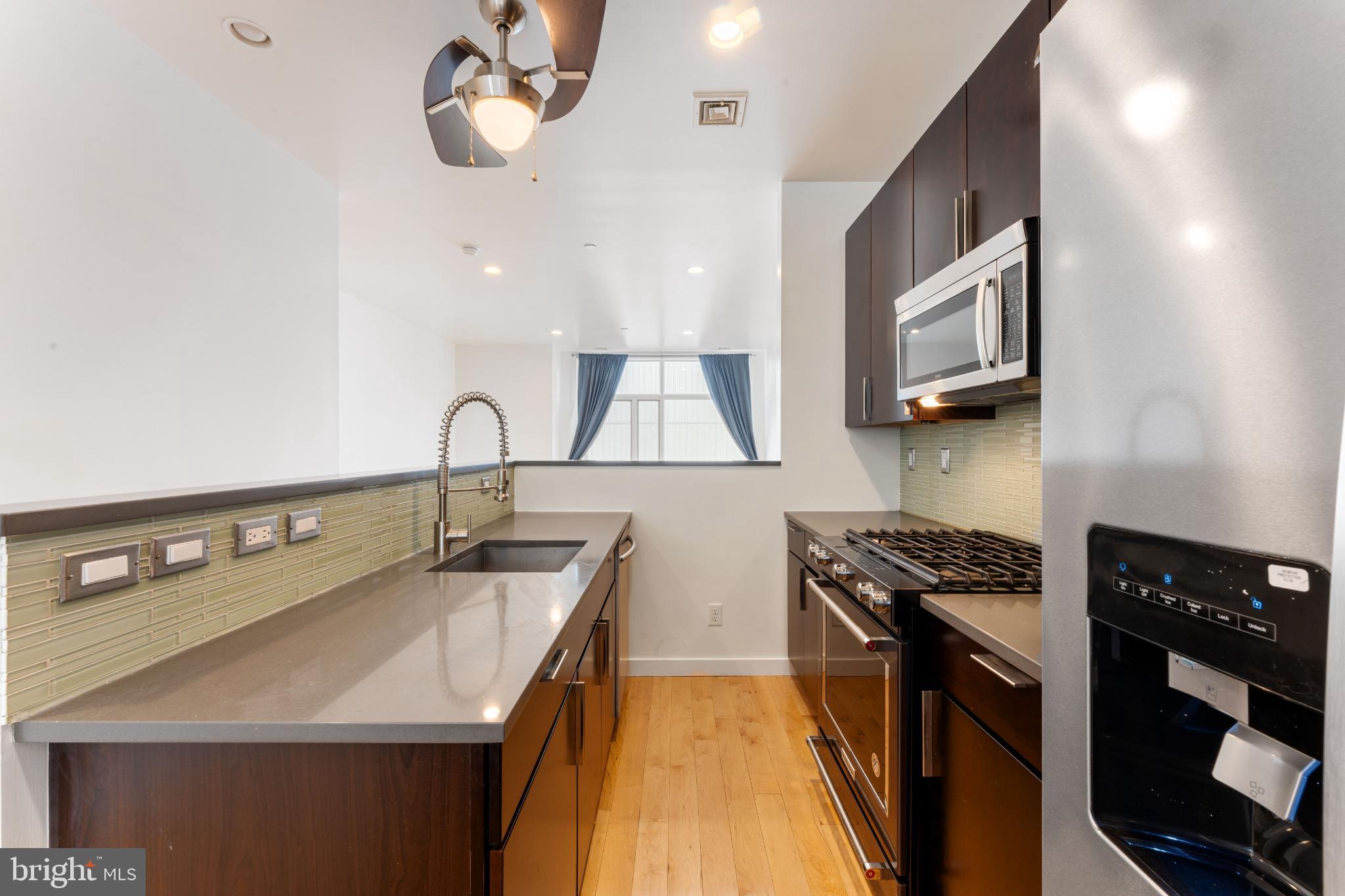 333 Green Street, Unit 7 Philadelphia, PA 19123 - Photo 18 of 40 Sleek modern kitchen with stylish finishes.
