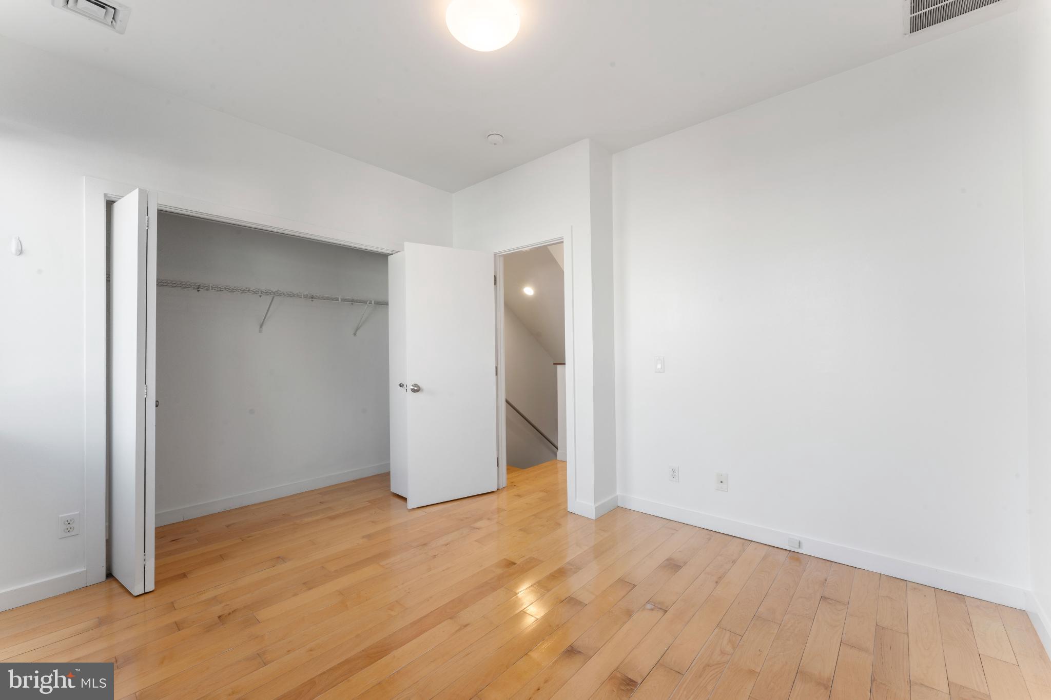 333 Green Street, Unit 7 Philadelphia, PA 19123 - Photo 23 of 40 Bright, spacious room with warm wood floors.