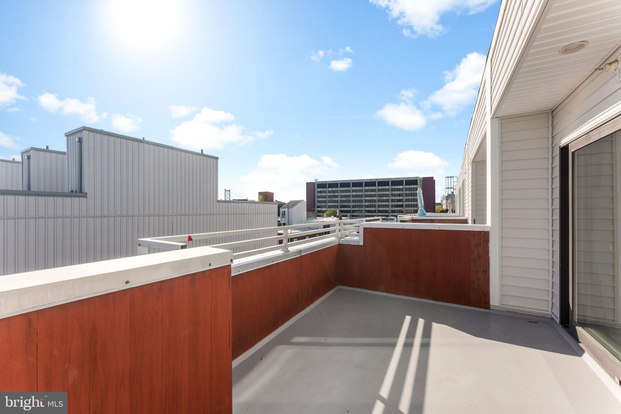 333 Green Street, Unit 7 Philadelphia, PA 19123 - Photo 36 of 40 Sunny urban balcony with modern views.