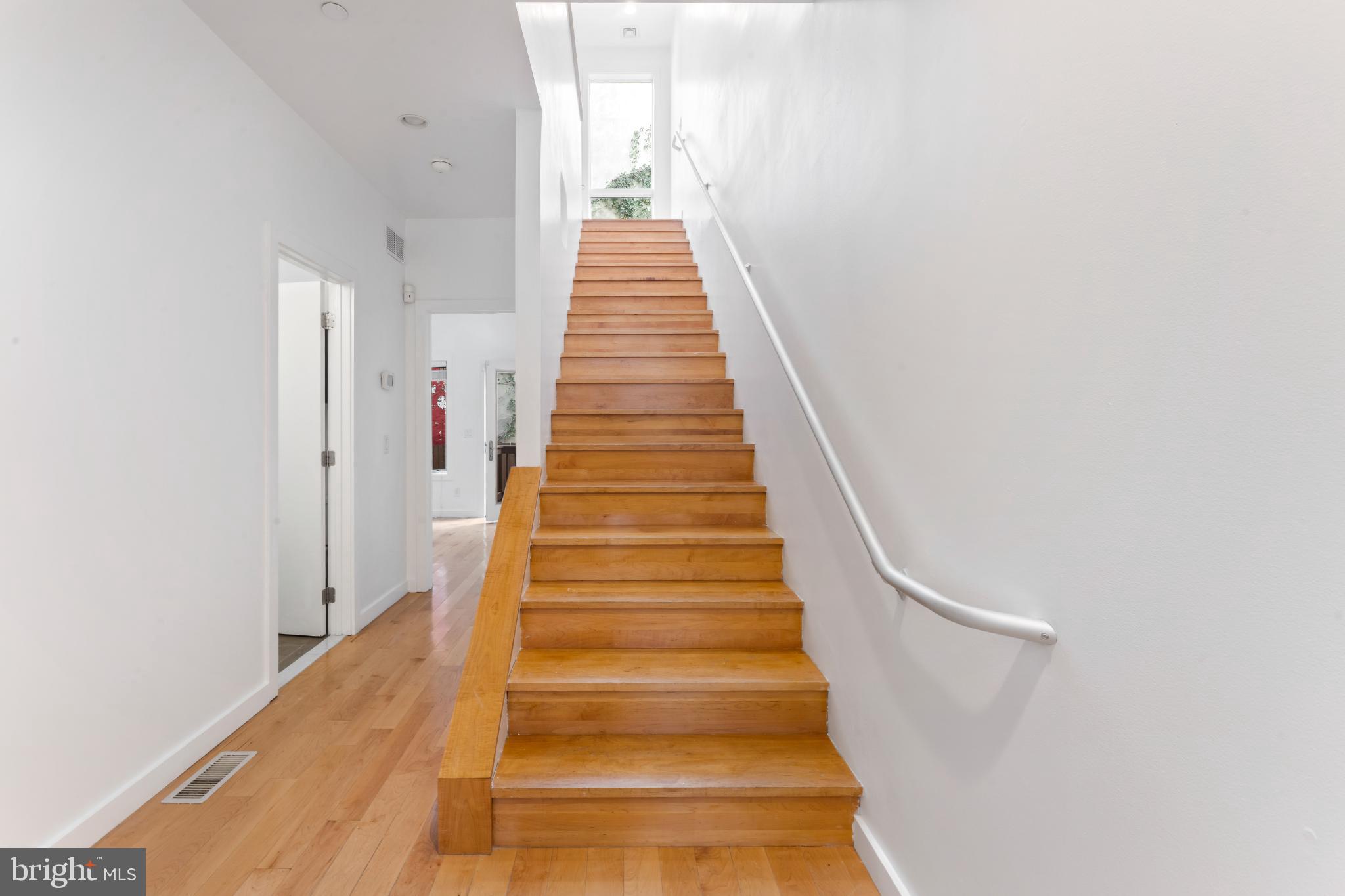 333 Green Street, Unit 7 Philadelphia, PA 19123 - Photo 4 of 40 Bright and inviting staircase to upper levels.