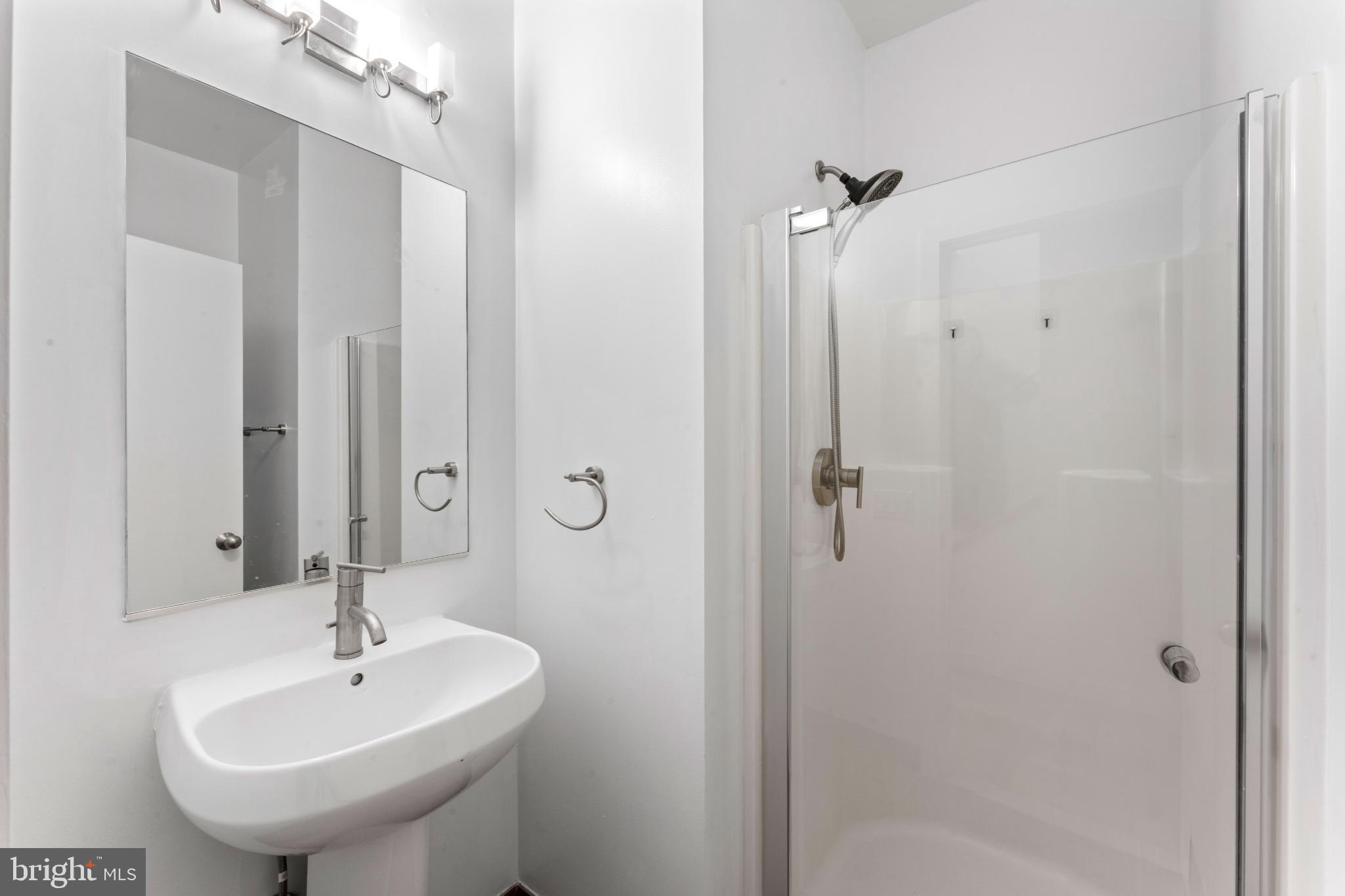 333 Green Street, Unit 7 Philadelphia, PA 19123 - Photo 5 of 40 Sleek modern bathroom with elegant fixtures.
