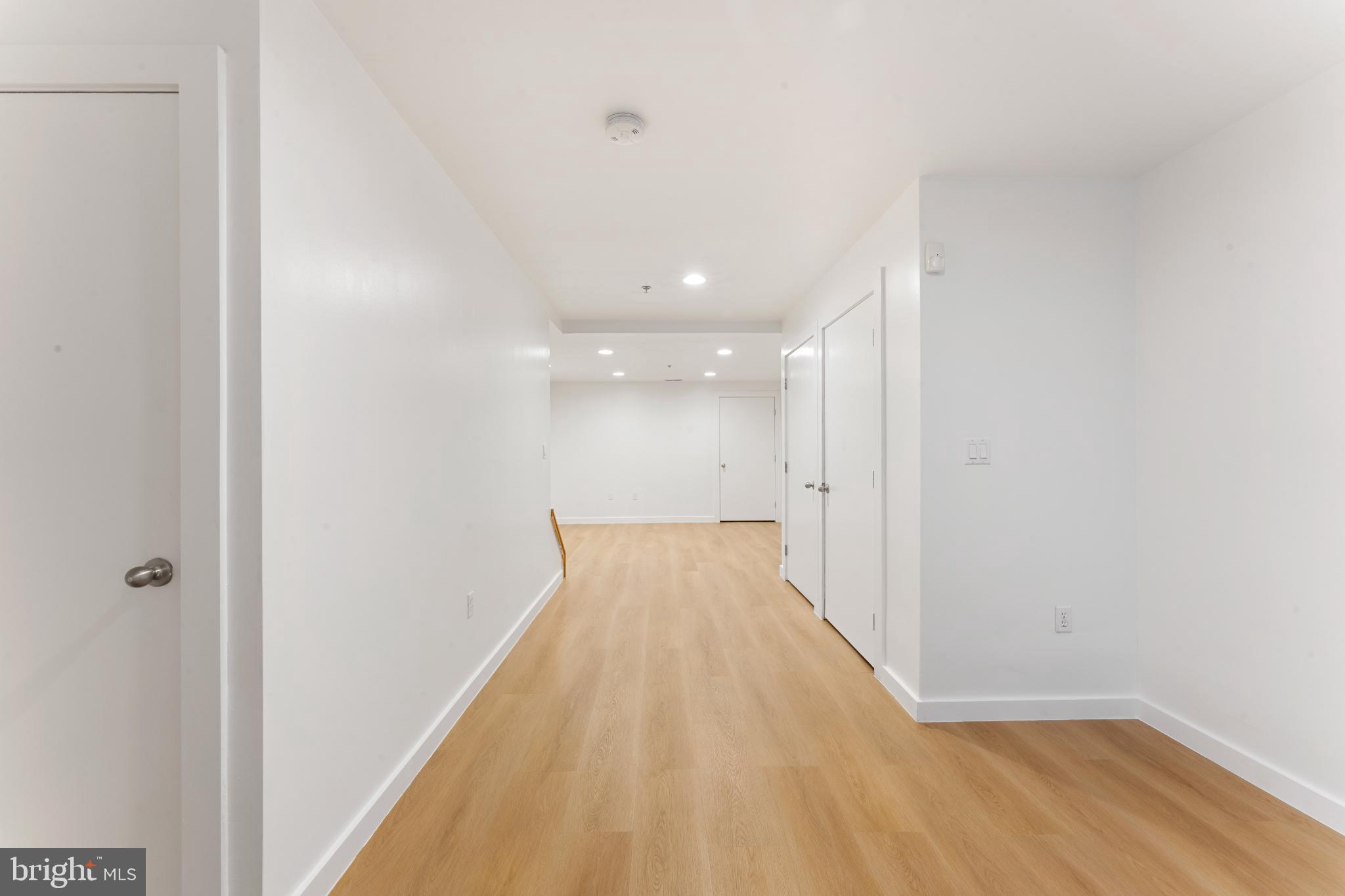 333 Green Street, Unit 7 Philadelphia, PA 19123 - Photo 10 of 40 Spacious, modern hallway with warm tones.