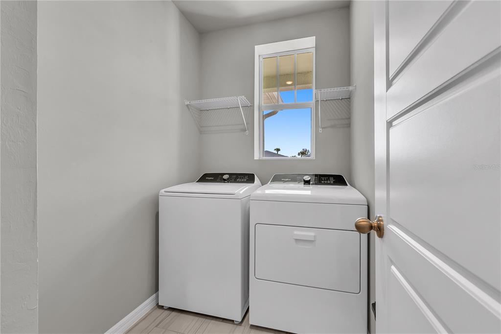 44254 Frontier Drive Punta Gorda, FL 33982 - Photo 4 of 48 a utility room with dryer and washer