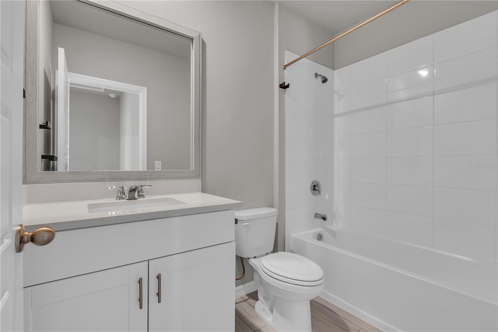 44254 Frontier Drive Punta Gorda, FL 33982 - Photo 8 of 48 a bathroom with a sink toilet vanity and shower