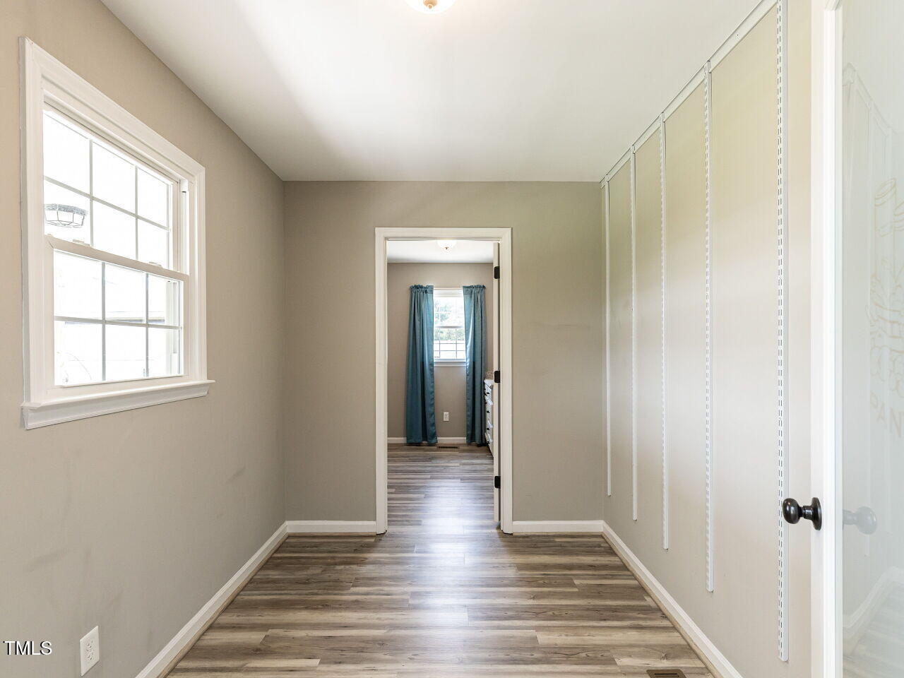 10336 Old Beulah Road Kenly, NC 27542 - Photo 20 of 71 a view of a hallway with wooden floor and closet