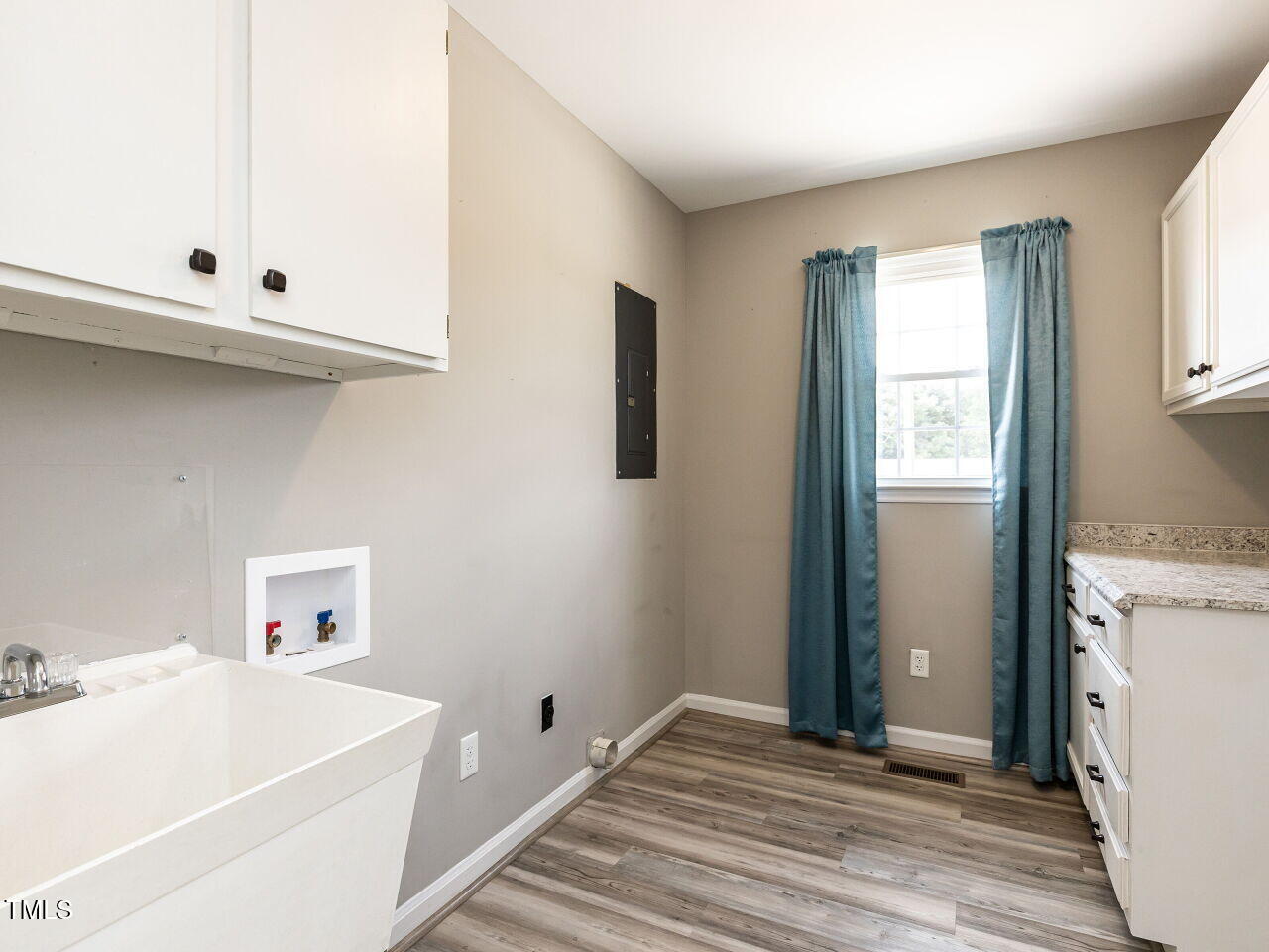 10336 Old Beulah Road Kenly, NC 27542 - Photo 21 of 71 a room with window and cabinets