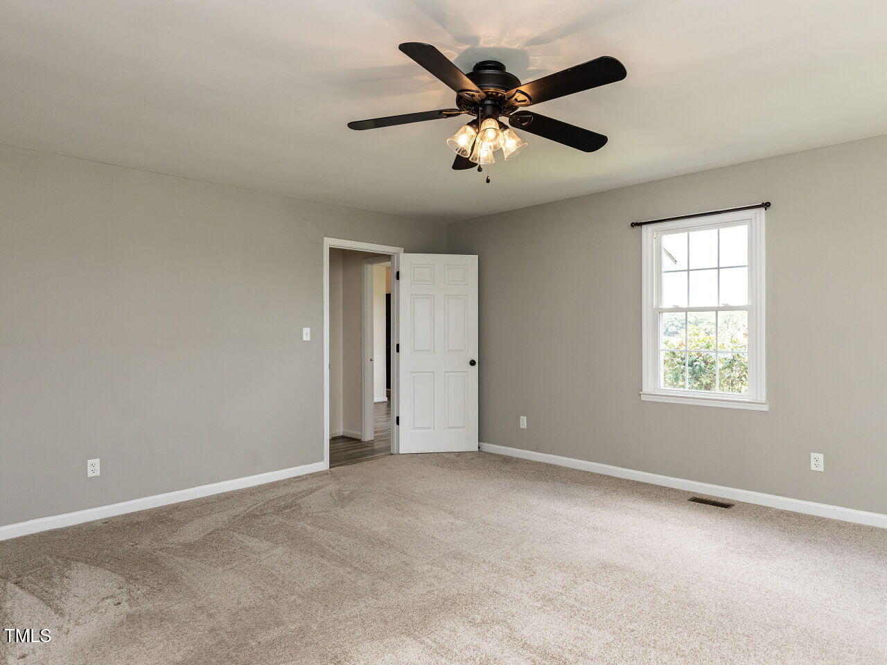10336 Old Beulah Road Kenly, NC 27542 - Photo 25 of 71 an empty room with windows and fan