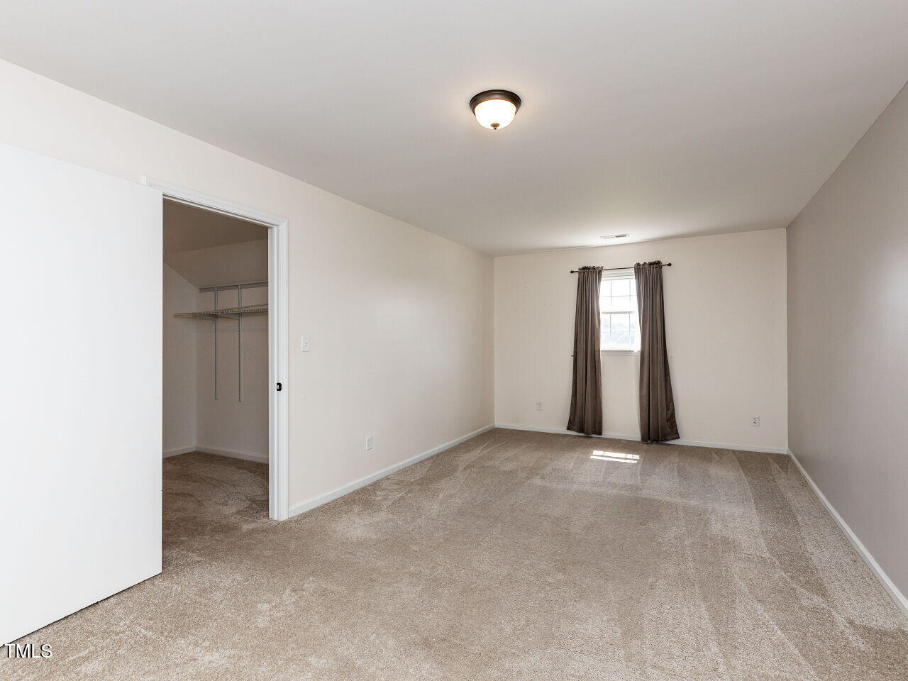 10336 Old Beulah Road Kenly, NC 27542 - Photo 29 of 71 an empty room with windows and closet