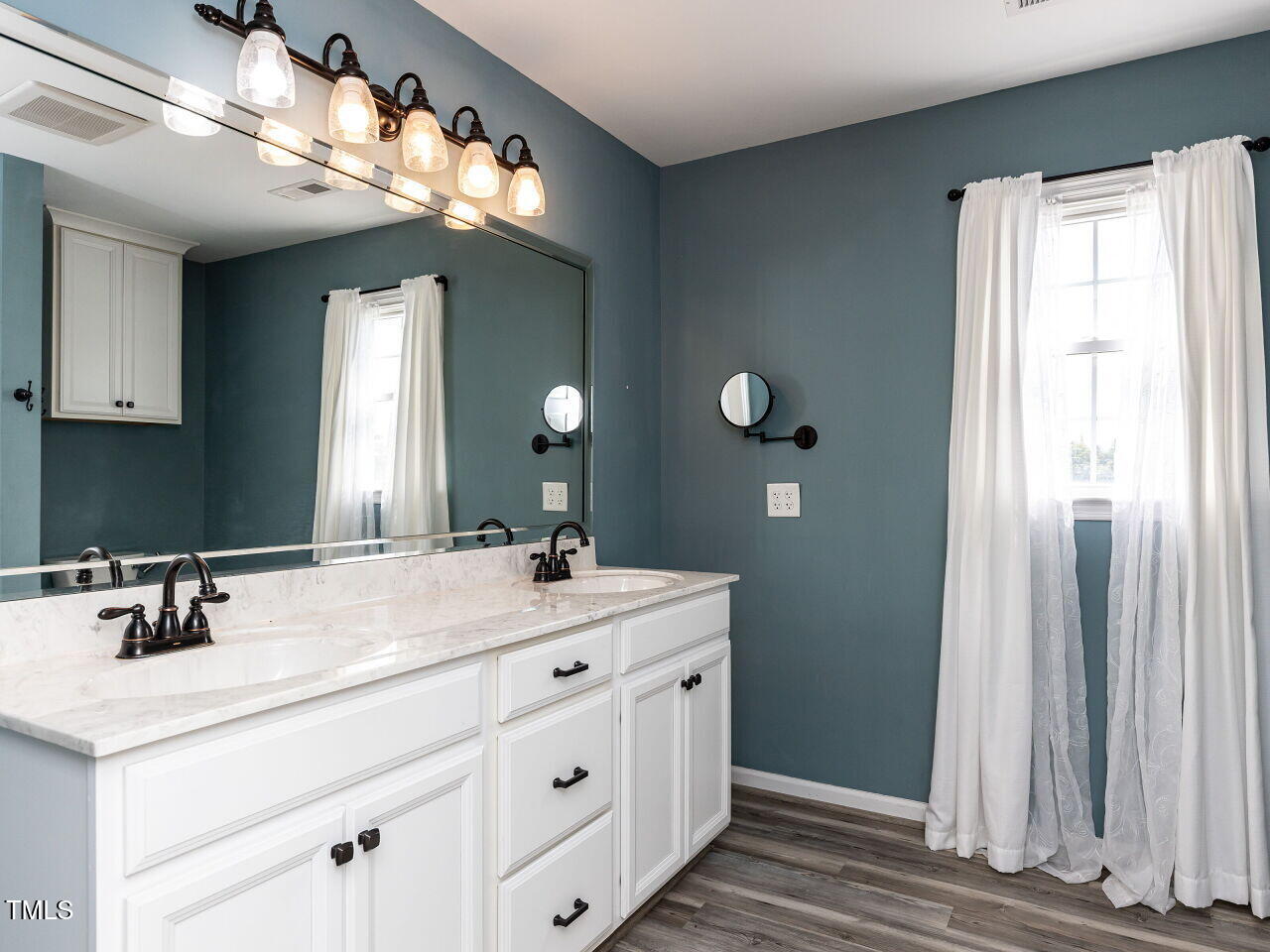 10336 Old Beulah Road Kenly, NC 27542 - Photo 31 of 71 a bathroom with a sink vanity and a mirror