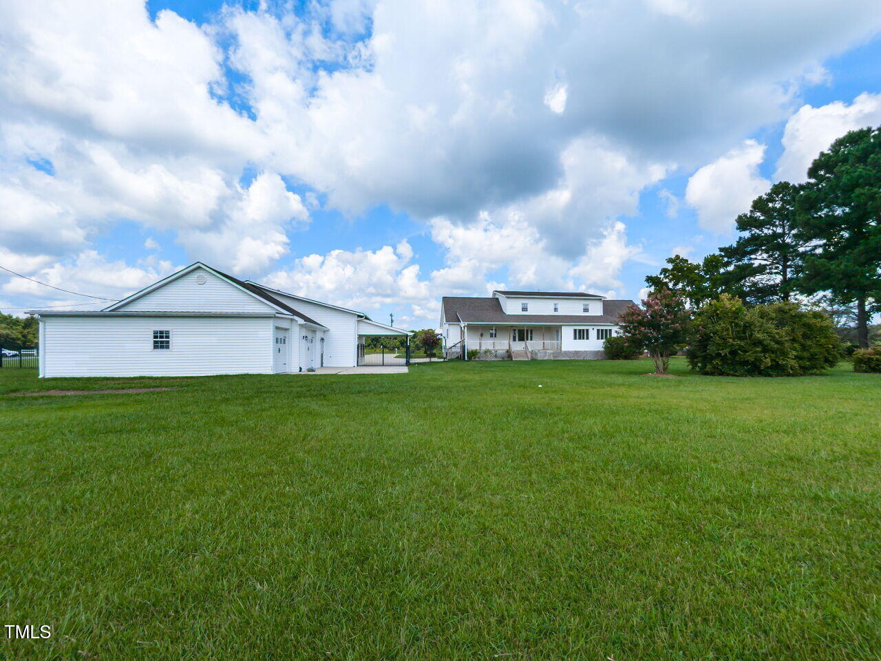 10336 Old Beulah Road Kenly, NC 27542 - Photo 39 of 71 a view of a house with a big yard and a large trees