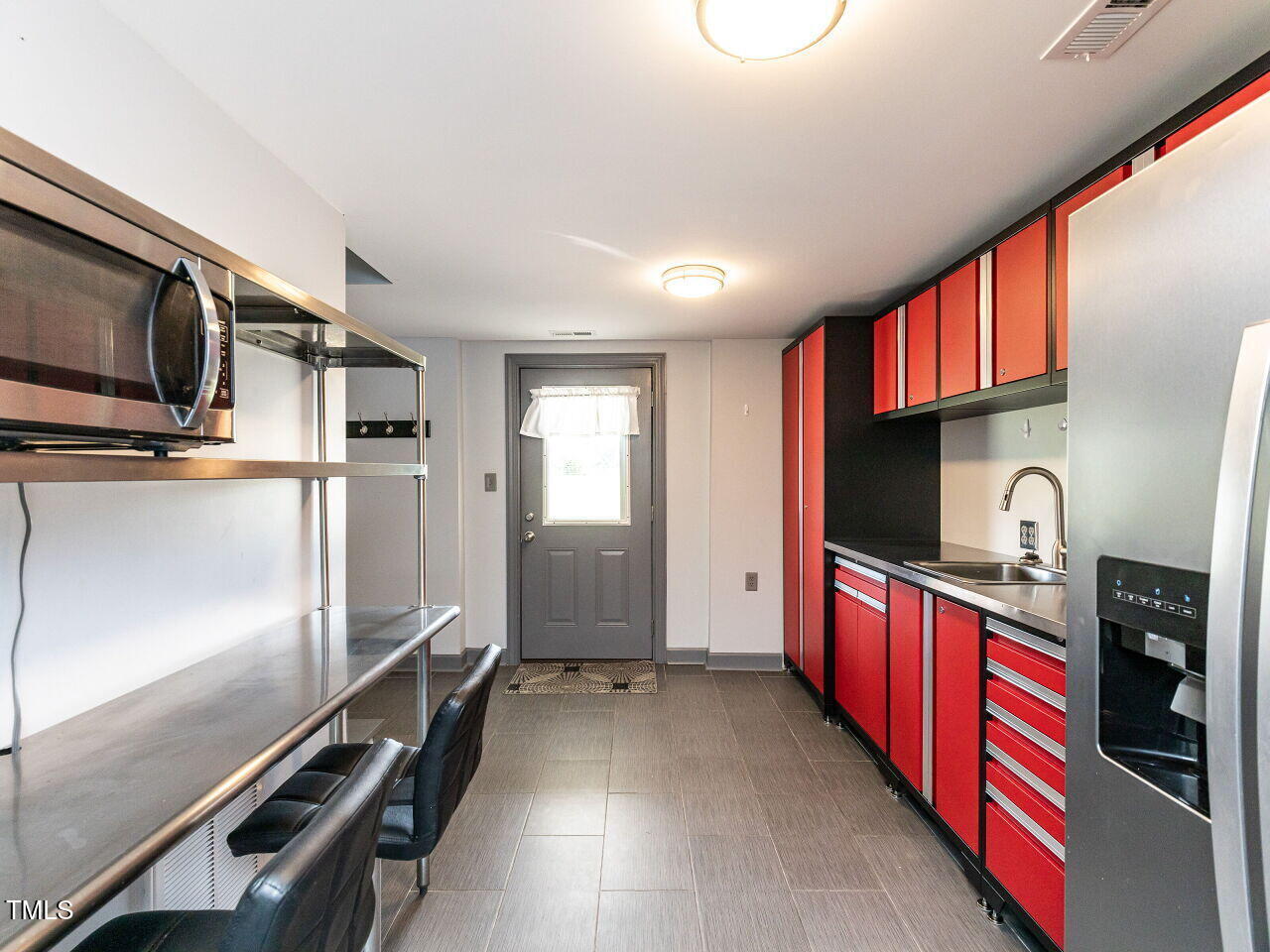 10336 Old Beulah Road Kenly, NC 27542 - Photo 45 of 71 a kitchen with stainless steel appliances a refrigerator and a sink