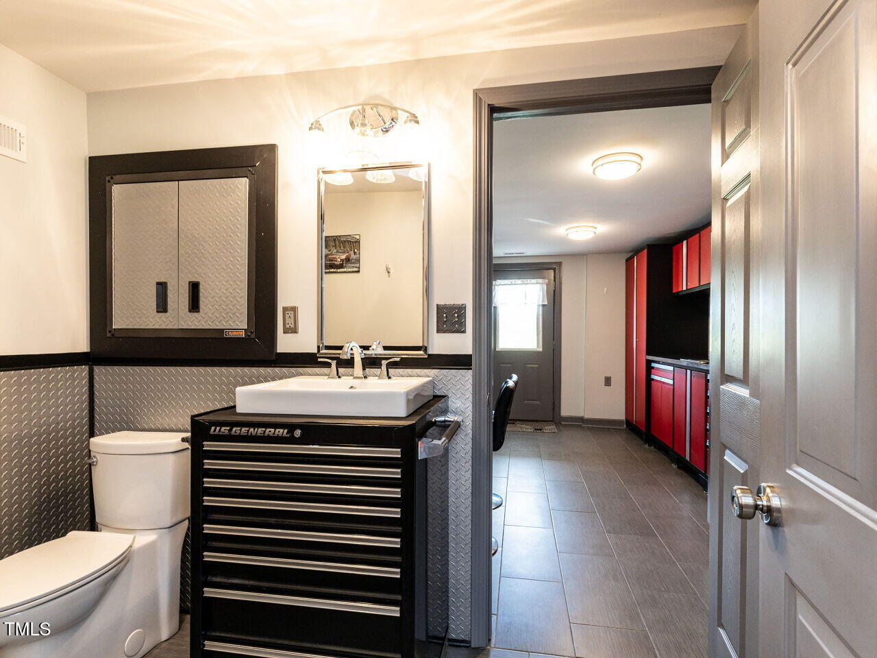 10336 Old Beulah Road Kenly, NC 27542 - Photo 47 of 71 a bathroom with a sink a toilet and mirror