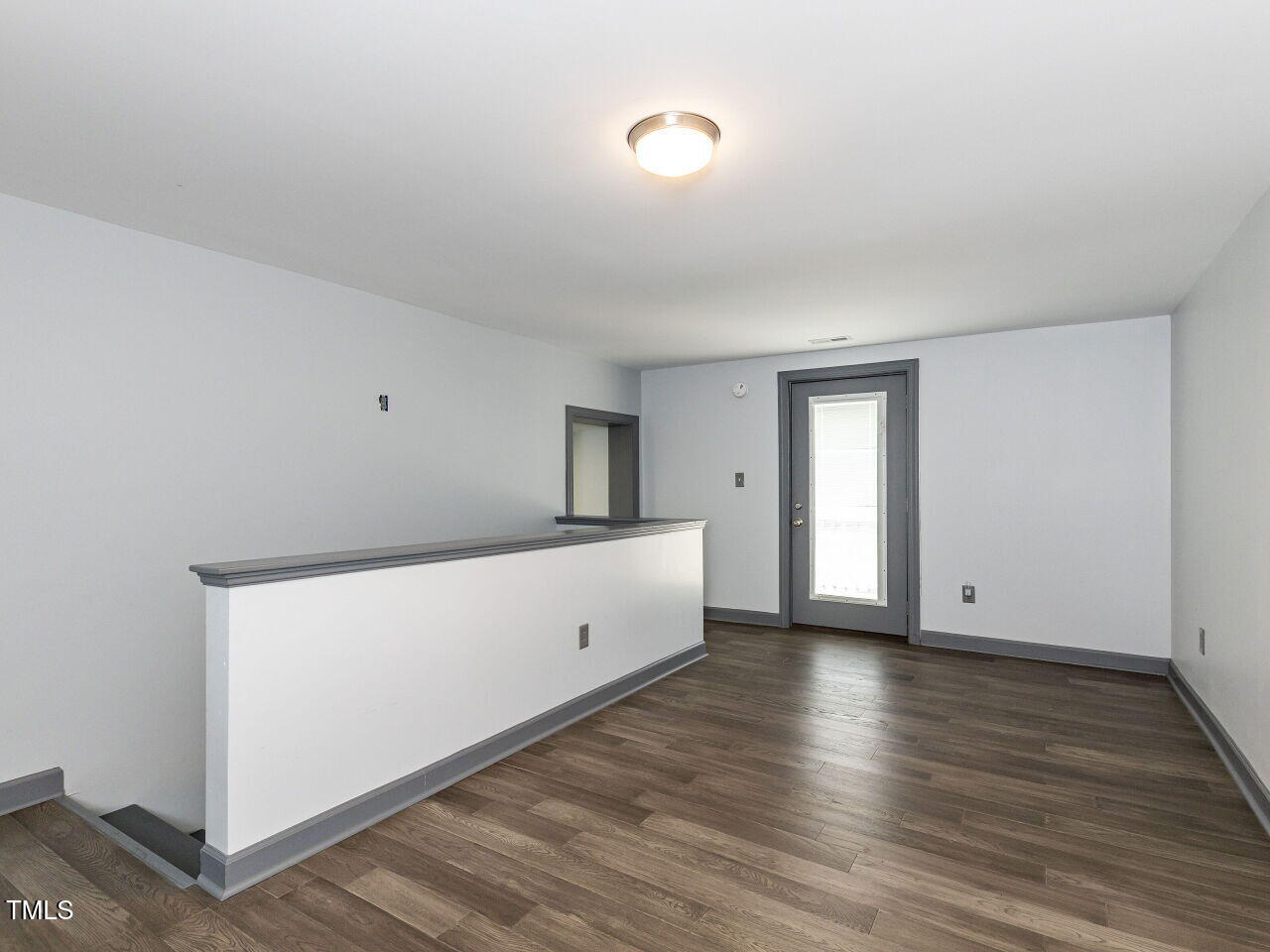10336 Old Beulah Road Kenly, NC 27542 - Photo 56 of 71 a view of an empty room with wooden floor